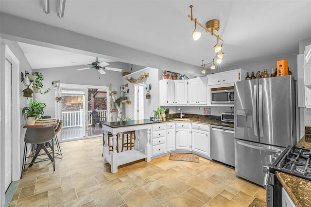 46 Quaker Hill Rd, Monroe, NY 10950 - kitchen with white cabinets, appliances with stainless steel finishes, and stone finish floor
