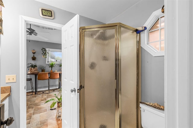 46 Quaker Hill Rd, Monroe, NY 10950 - bathroom with a stall shower, a ceiling fan, stone finish floor, toilet, and vanity