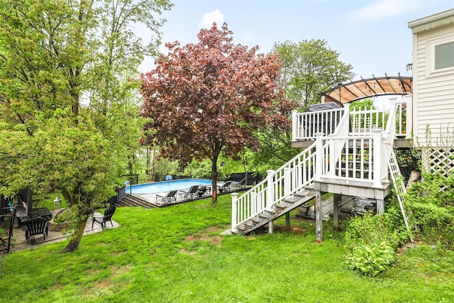 46 Quaker Hill Rd, Monroe, NY 10950 - view of yard featuring stairway, a wooden deck, and an outdoor pool