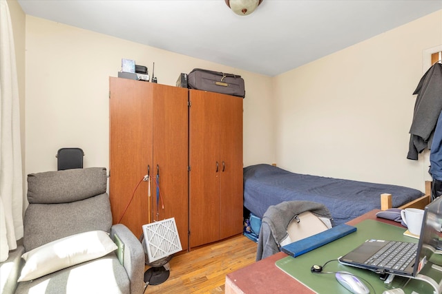 bedroom with light wood-type flooring