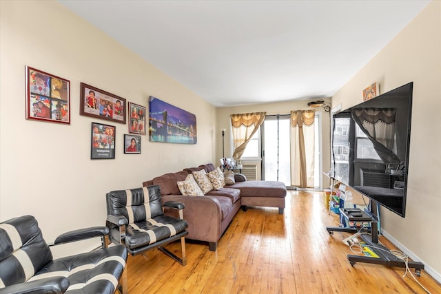 living area with hardwood / wood-style floors