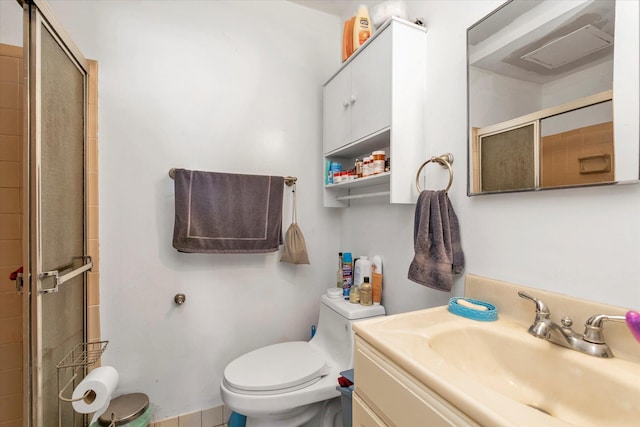 full bath featuring vanity, toilet, and a stall shower