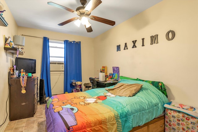 bedroom featuring cooling unit and ceiling fan