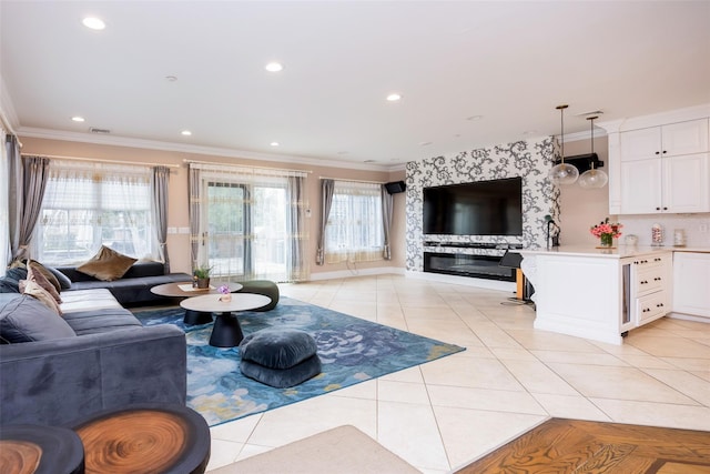 living area featuring light tile patterned floors, plenty of natural light, crown molding, and recessed lighting