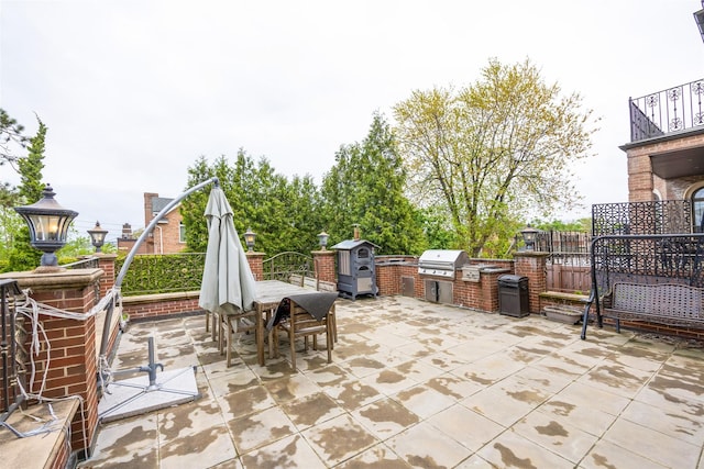 150-50 6th Ave, Whitestone, NY 11357 - view of patio with exterior kitchen, outdoor dining area, area for grilling, and fence