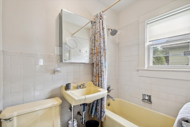 330 Union Ave, Peekskill, NY 10566 - bathroom with shower / tub combo with curtain, tile walls, and backsplash