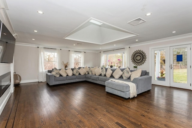 living area featuring recessed lighting, ornamental molding, visible vents, and wood finished floors