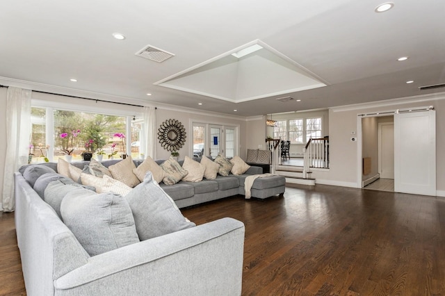 living area featuring recessed lighting, ornamental molding, visible vents, stairs, and wood finished floors