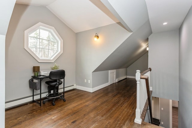 home office with a baseboard radiator, baseboard heating, baseboards, wood-type flooring, and vaulted ceiling