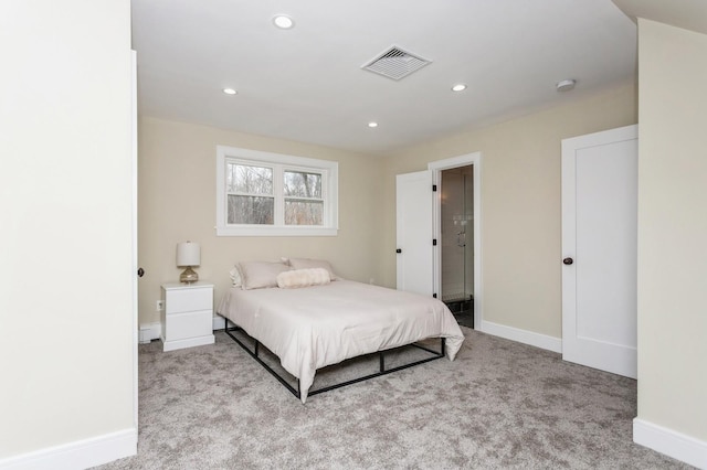 bedroom featuring baseboards, visible vents, and carpet