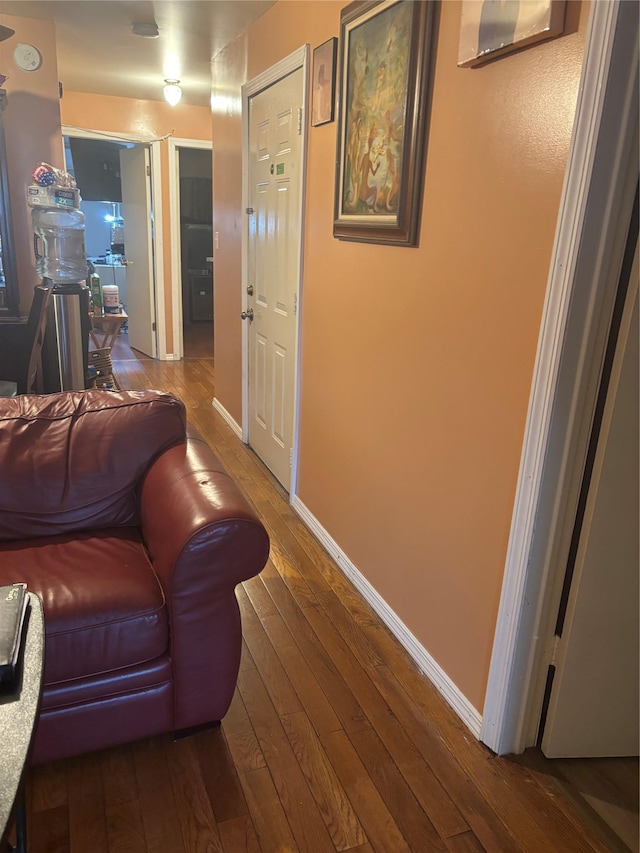 living room featuring baseboards and wood-type flooring
