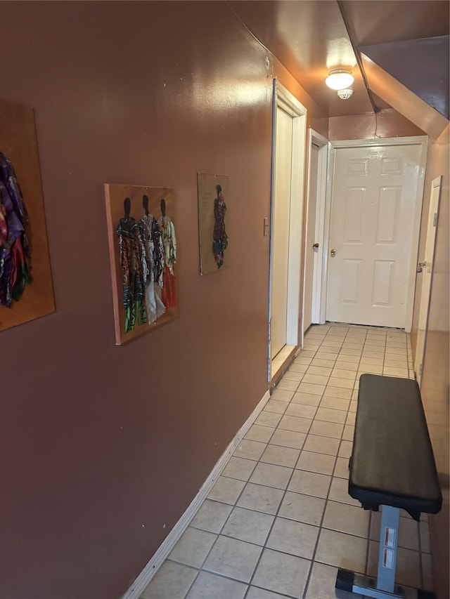 hallway featuring light tile patterned floors