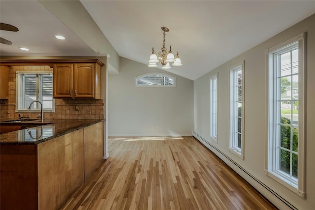 311 Atlantic, Massapequa Park, NY 11762 - kitchen featuring baseboard heating, tasteful backsplash, dark stone countertops, a chandelier, and a sink