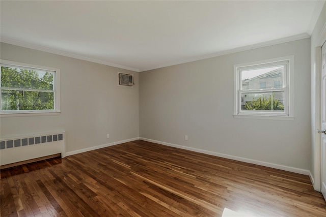 311 Atlantic, Massapequa Park, NY 11762 - empty room featuring radiator heating unit, dark wood-style flooring, ornamental molding, baseboards, and a wall unit AC