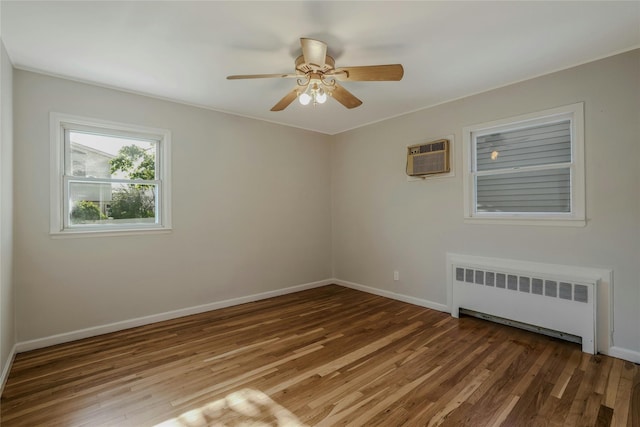 311 Atlantic, Massapequa Park, NY 11762 - empty room with radiator, wood finished floors, a wall mounted AC, ceiling fan, and baseboards