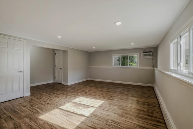 311 Atlantic, Massapequa Park, NY 11762 - unfurnished room with wood finished floors, baseboards, baseboard heating, and recessed lighting