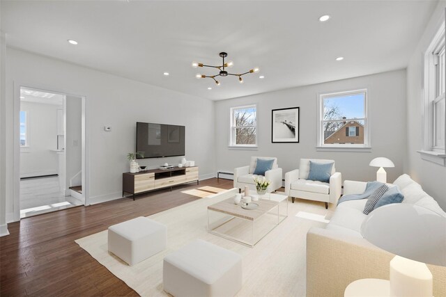 247 Osborne Hill Rd, Fishkill, NY 12524 - living area with wood finished floors, baseboards, a baseboard heating unit, and recessed lighting
