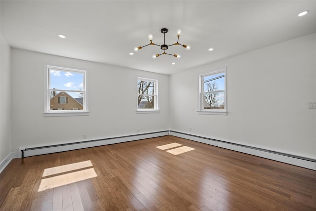 247 Osborne Hill Rd, Fishkill, NY 12524 - spare room featuring wood finished floors, recessed lighting, an inviting chandelier, baseboard heating, and baseboards