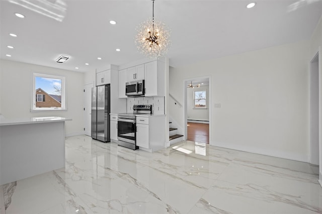 247 Osborne Hill Rd, Fishkill, NY 12524 - kitchen with baseboard heating, recessed lighting, marble finish floor, an inviting chandelier, and stainless steel appliances