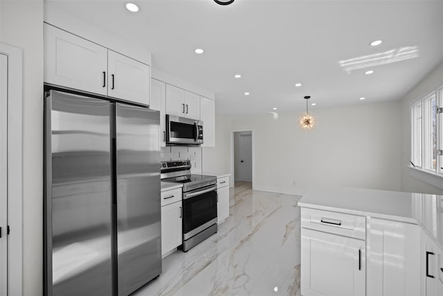 247 Osborne Hill Rd, Fishkill, NY 12524 - kitchen featuring recessed lighting, marble finish floor, light countertops, white cabinets, and appliances with stainless steel finishes