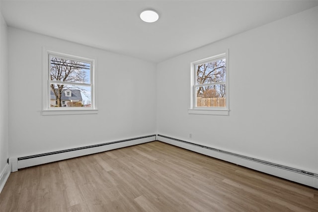 247 Osborne Hill Rd, Fishkill, NY 12524 - empty room featuring plenty of natural light, wood finished floors, and a baseboard radiator