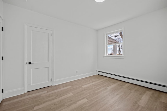 247 Osborne Hill Rd, Fishkill, NY 12524 - unfurnished bedroom featuring light wood-style flooring, baseboards, and baseboard heating