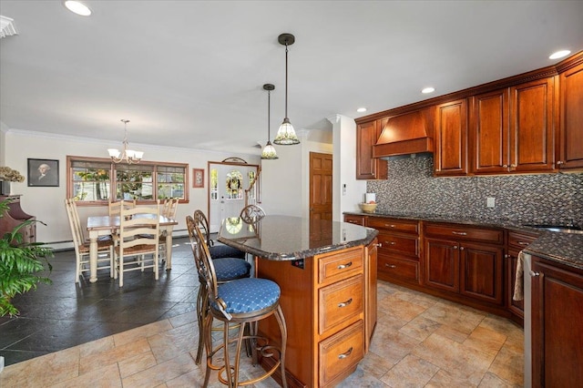 340 Martin Pl, Bethpage, NY 11714 - kitchen featuring stone tile floors, a breakfast bar, custom exhaust hood, ornamental molding, and a chandelier