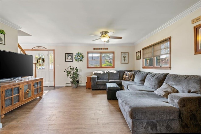 340 Martin Pl, Bethpage, NY 11714 - living room featuring hardwood / wood-style flooring, crown molding, ceiling fan, baseboards, and baseboard heating