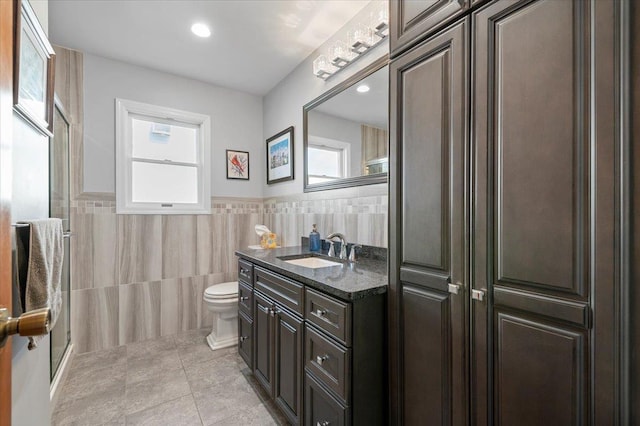 340 Martin Pl, Bethpage, NY 11714 - bathroom with toilet, vanity, tile walls, tile patterned floors, and recessed lighting