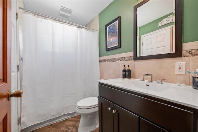 340 Martin Pl, Bethpage, NY 11714 - full bathroom featuring toilet, vanity, tile walls, a shower with curtain, and a wainscoted wall