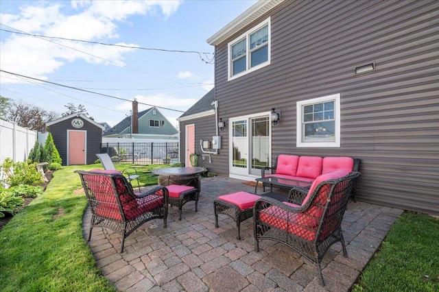 340 Martin Pl, Bethpage, NY 11714 - view of patio with outdoor lounge area, fence, a storage unit, and an outbuilding