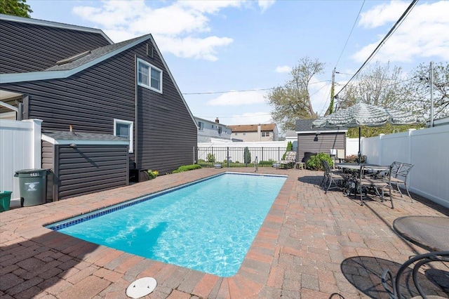 340 Martin Pl, Bethpage, NY 11714 - view of swimming pool featuring a patio, a fenced backyard, an outdoor structure, and a storage unit