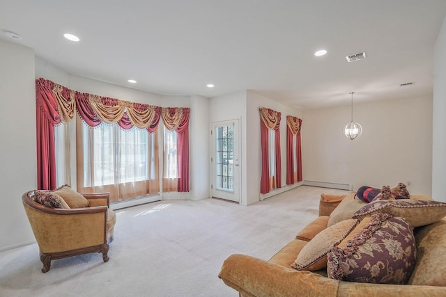 carpeted living room featuring a baseboard heating unit, recessed lighting, and baseboards