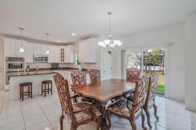 dining space with a chandelier, light tile patterned flooring, and recessed lighting