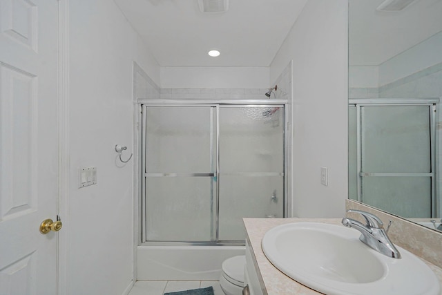 full bath featuring toilet, vanity, tile patterned floors, enclosed tub / shower combo, and recessed lighting