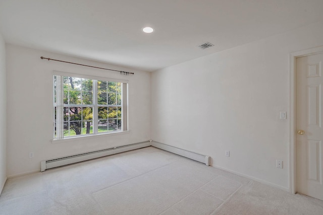 spare room with light carpet, a baseboard heating unit, recessed lighting, and baseboards