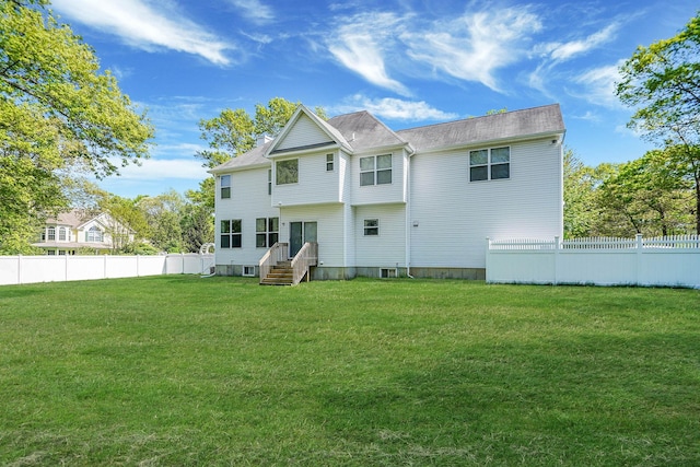 rear view of house featuring entry steps