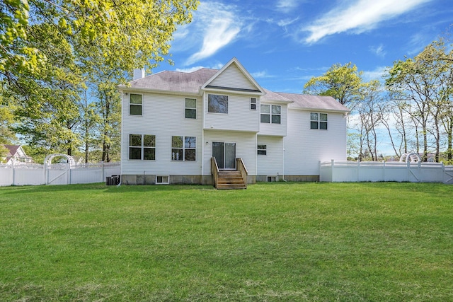 back of house with entry steps, a chimney, and central AC unit
