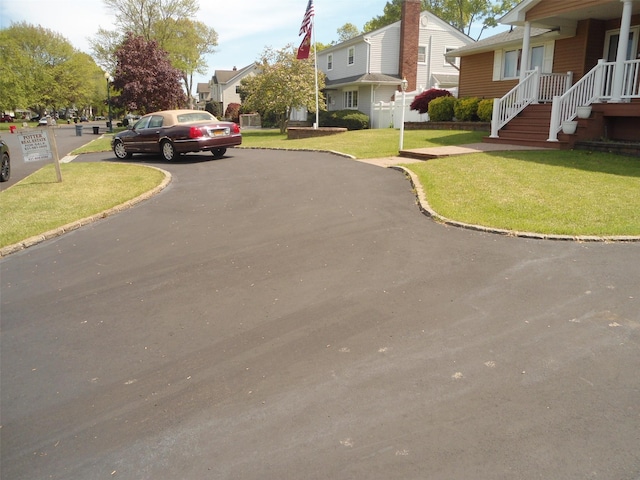 212 Wensley Ln, East Islip, NY 11730 - view of asphalt street featuring curbs and a residential view