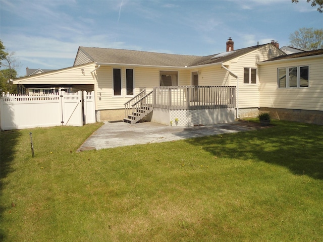 212 Wensley Ln, East Islip, NY 11730 - back of property with a patio, a deck, and a gate