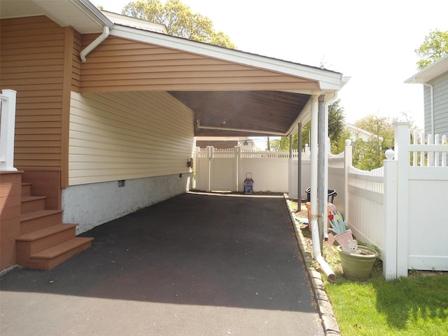 212 Wensley Ln, East Islip, NY 11730 - view of car parking with fence and a carport
