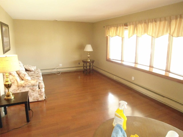 212 Wensley Ln, East Islip, NY 11730 - unfurnished room with a baseboard radiator and wood finished floors