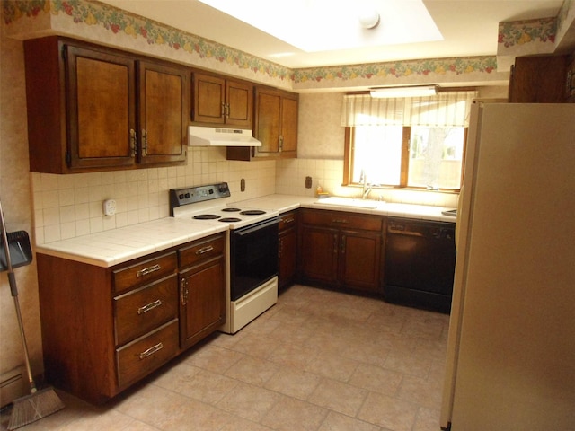212 Wensley Ln, East Islip, NY 11730 - kitchen featuring electric range oven, freestanding refrigerator, black dishwasher, a sink, and under cabinet range hood