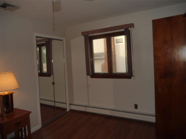 212 Wensley Ln, East Islip, NY 11730 - empty room featuring wood finished floors, a ceiling fan, a baseboard heating unit, and baseboards