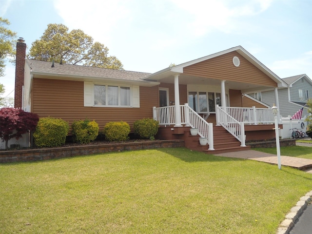 212 Wensley Ln, East Islip, NY 11730 - ranch-style house with a chimney, a front yard, covered porch, and roof with shingles