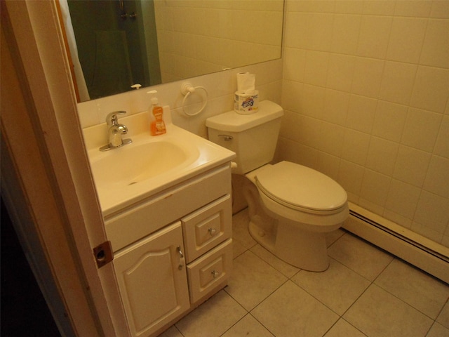 212 Wensley Ln, East Islip, NY 11730 - bathroom with baseboard heating, vanity, tile patterned floors, toilet, and tile walls
