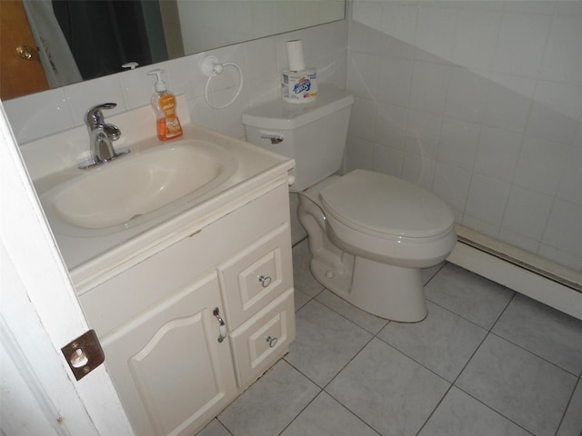 212 Wensley Ln, East Islip, NY 11730 - bathroom with vanity, tile walls, toilet, a baseboard radiator, and tile patterned floors
