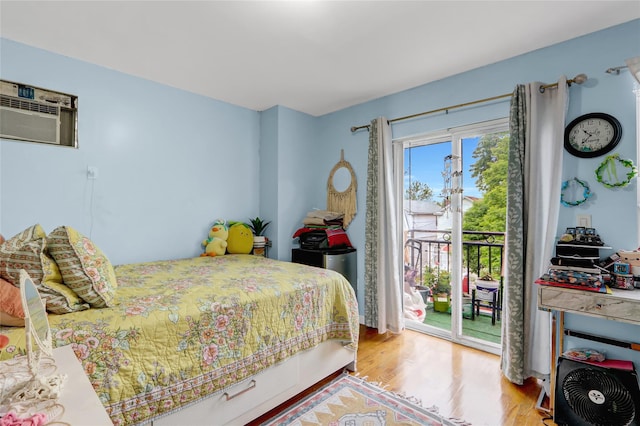 1934 Chatterton Ave, Bronx, NY 10472 - bedroom featuring access to outside, wood finished floors, and a wall mounted AC