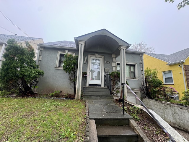 548 S 10th Ave, Mount Vernon, NY 10550 - view of front facade with stucco siding and a front yard