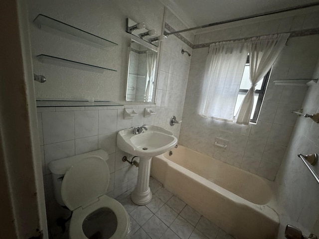 548 S 10th Ave, Mount Vernon, NY 10550 - bathroom with toilet, tile walls, tile patterned floors, and washtub / shower combination